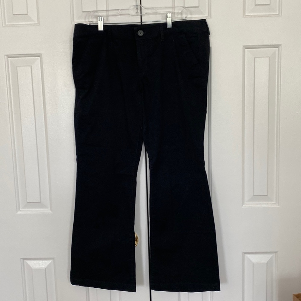 American Eagle Outfitters black kick-boot pants.